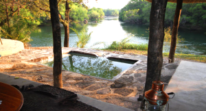 Kuntunta Safari Lodge pool with view of the great Kafue river
